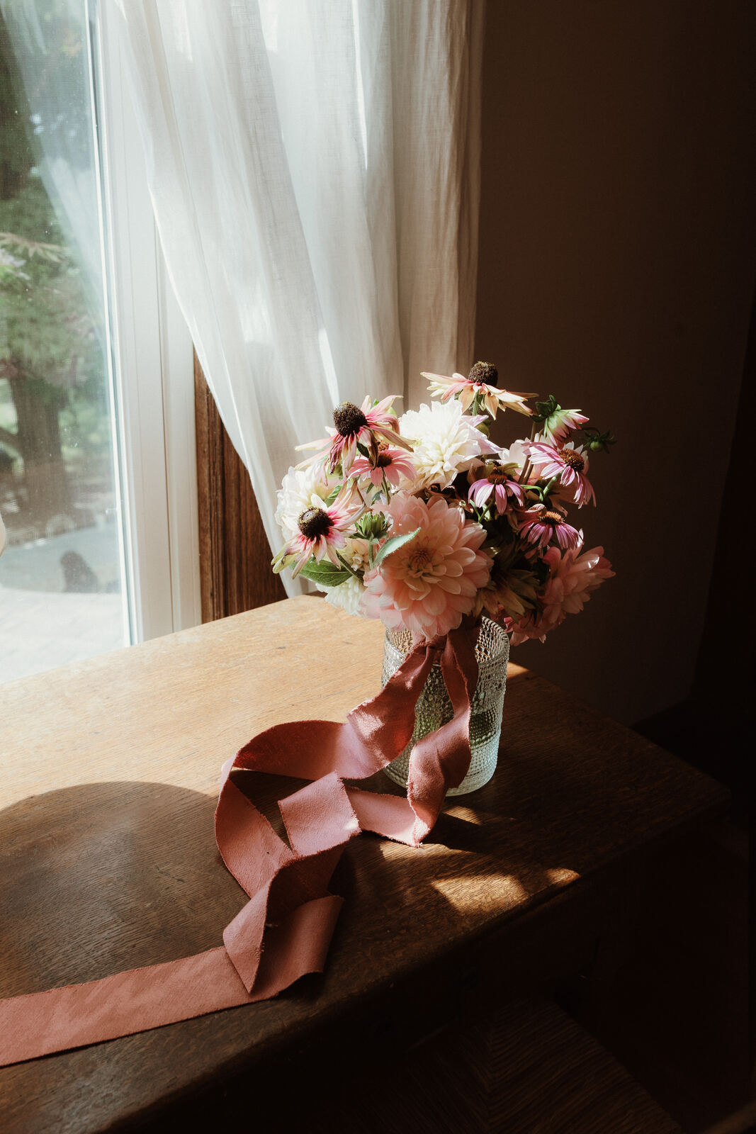 Bouquet on a windowsill in morning light