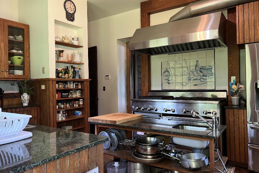 The restaurant-quality kitchen with a six-burner range