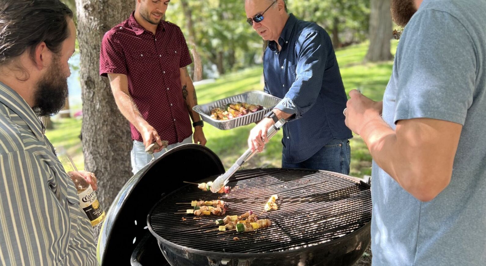 Family and friends grilling on the lawn