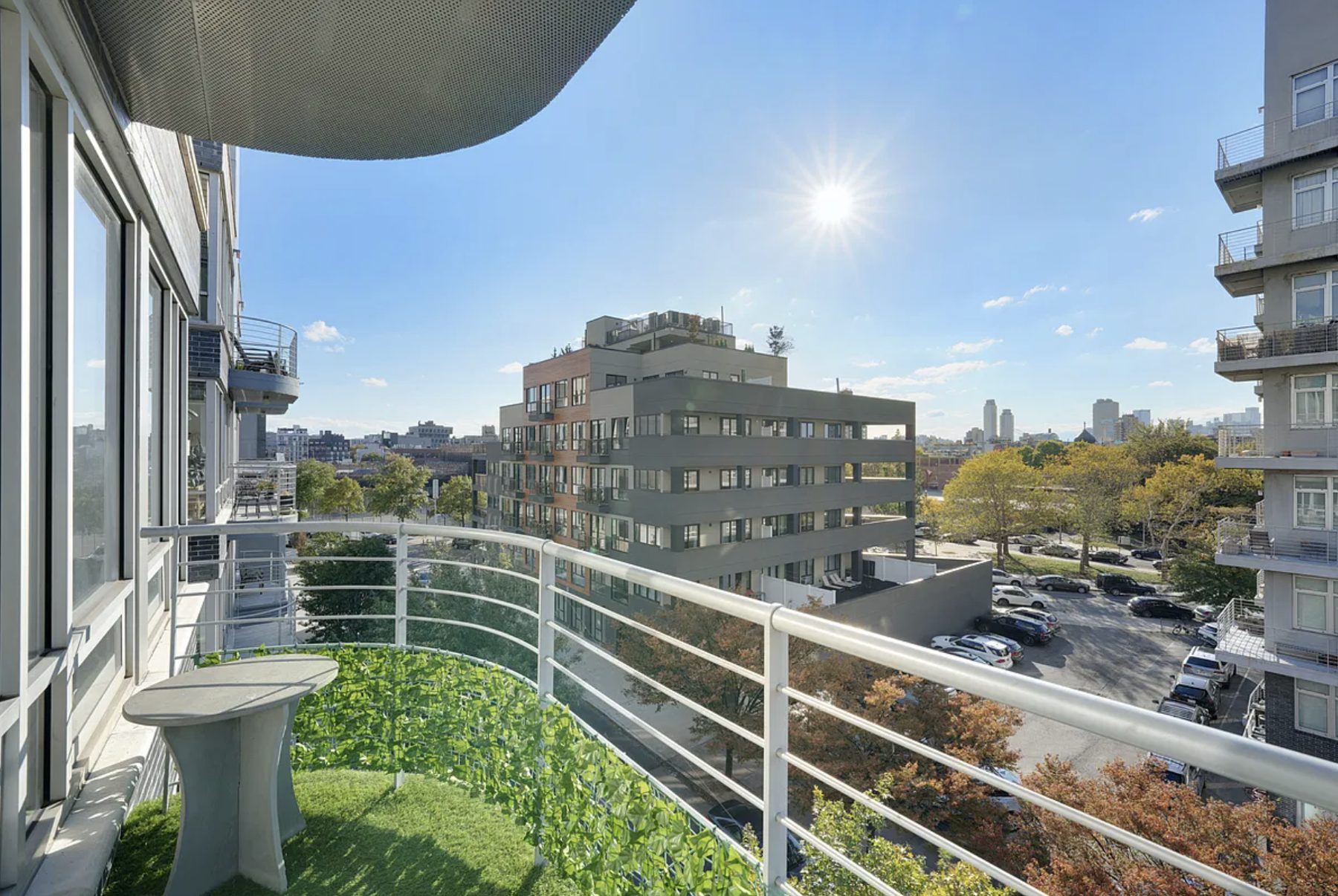 Private balcony overlooking tree-lined Greenpoint streets