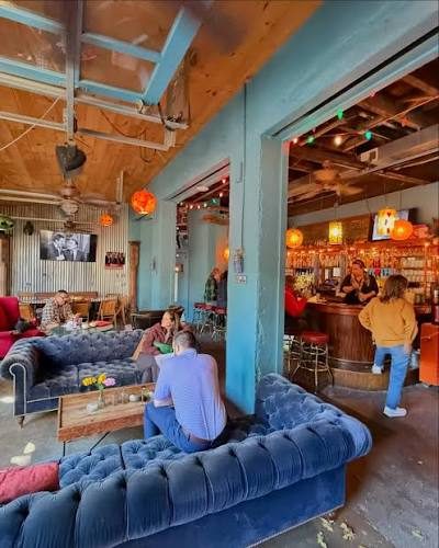 Velvet sofas and the bar at Backbar