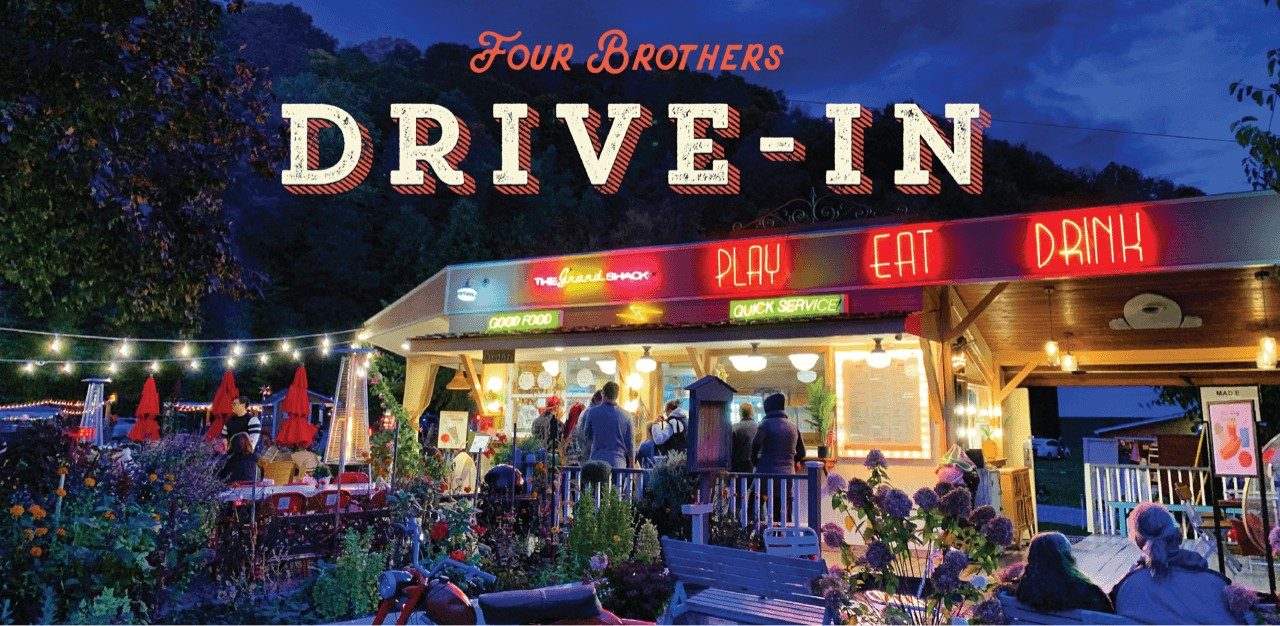 Four Brothers Drive-in snack bar lit up at night