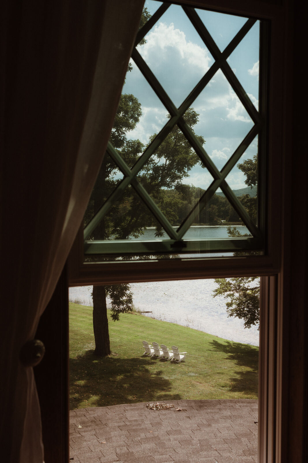 View of the lake through a diamond-paned window
